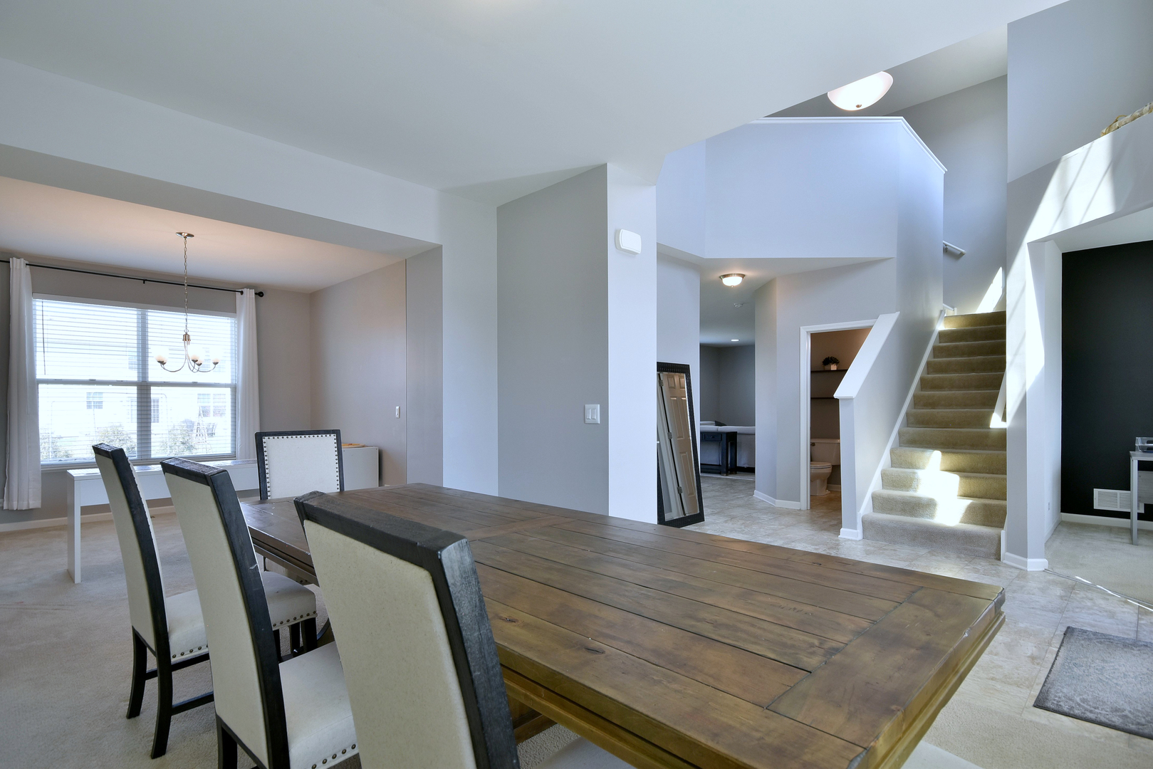 168 Reston Lane Gilberts, IL 60136 - Photo 10 of 43 a view of a dining room with furniture and a large window