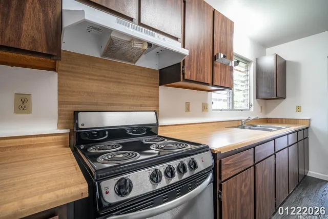 a kitchen with a stove and a microwave