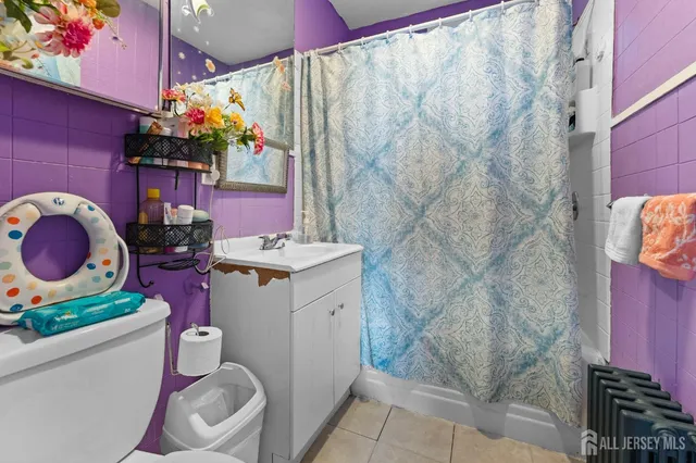 a bathroom with a sink mirror vanity and toilet