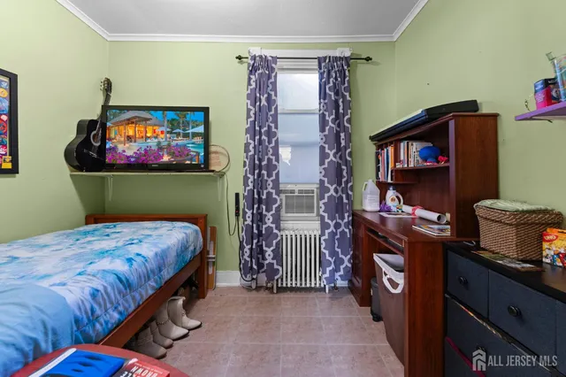 a bedroom with a bed and a fireplace