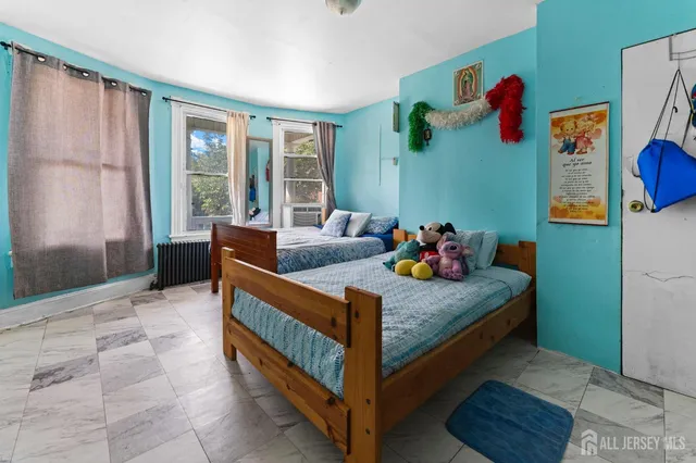 a bed room with a bed and a window