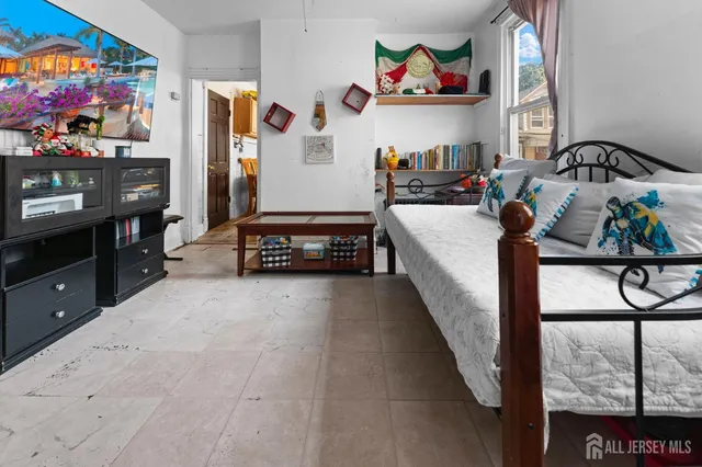 a bedroom with furniture and a bed