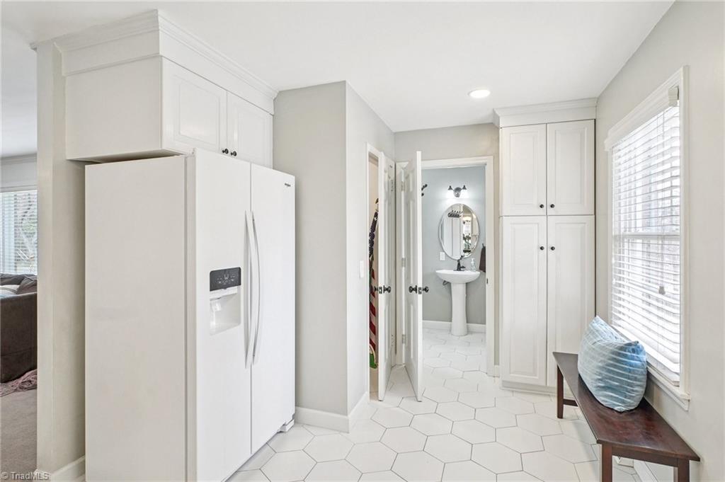 1412 Hobbs Road Greensboro, NC 27408 - Photo 12 of 47 Mudroom space leads to powder room