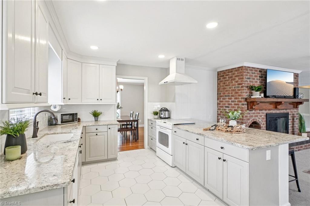 1412 Hobbs Road Greensboro, NC 27408 - Photo 16 of 47 Open to the cozy family area