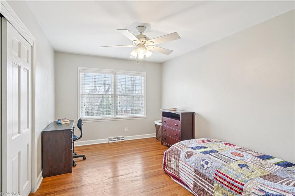 1412 Hobbs Road Greensboro, NC 27408 - Photo 32 of 47 This bedroom overlooks the backyard space