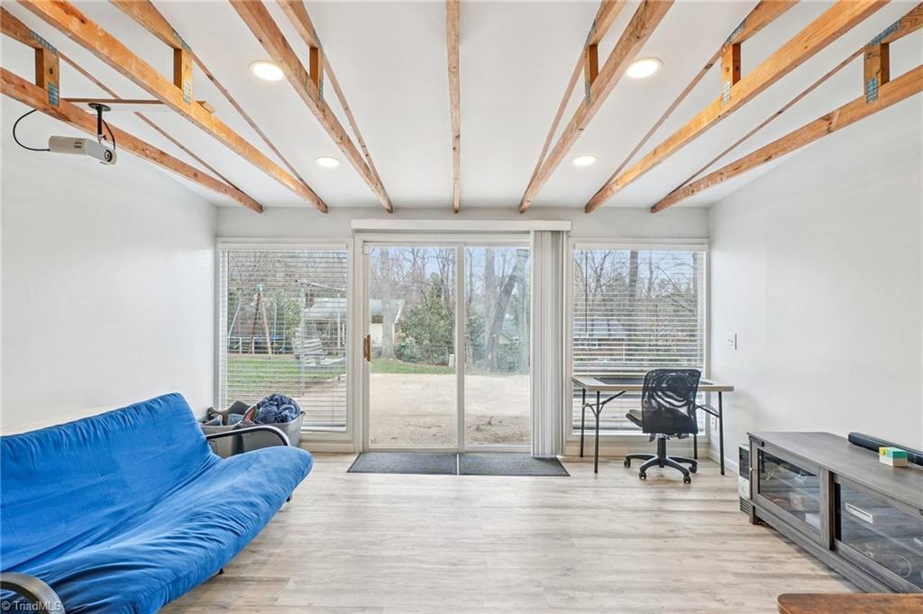 1412 Hobbs Road Greensboro, NC 27408 - Photo 35 of 47 Sunny room in the basement with a "wall of Windows" makes for a perfect Office space!