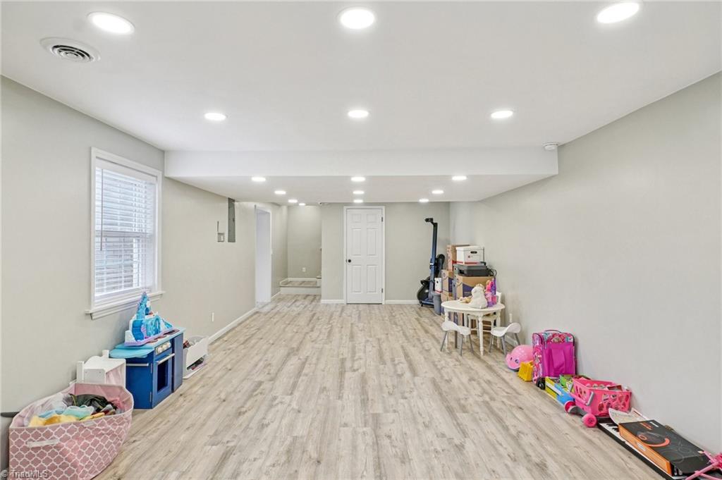 1412 Hobbs Road Greensboro, NC 27408 - Photo 37 of 47 LVP flooring and updated ceilings!