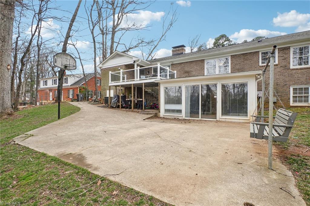 1412 Hobbs Road Greensboro, NC 27408 - Photo 39 of 47 Plenty of patio space complete with Porch Swing!