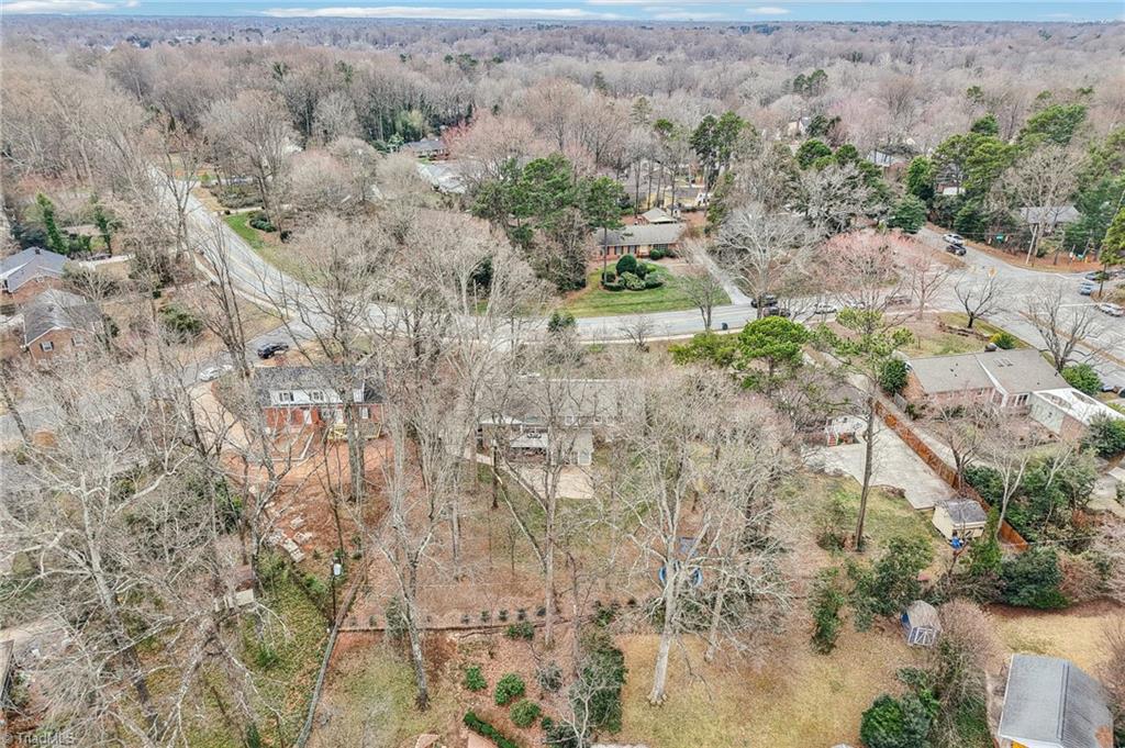 1412 Hobbs Road Greensboro, NC 27408 - Photo 46 of 47 Nestled on a lot with lots of trees ~ Spring is almost here!