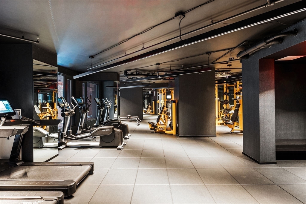 55 Lagrange Street, Unit 409 Boston, MA 02111 - Photo 25 of 29 a view of a room with gym equipment