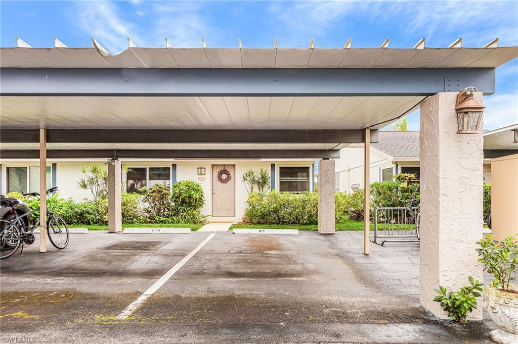 5579 Rattlesnake Hammock Road, Unit B9 Naples, FL 34113 - Photo 20 of 20 a view of a house with a garden