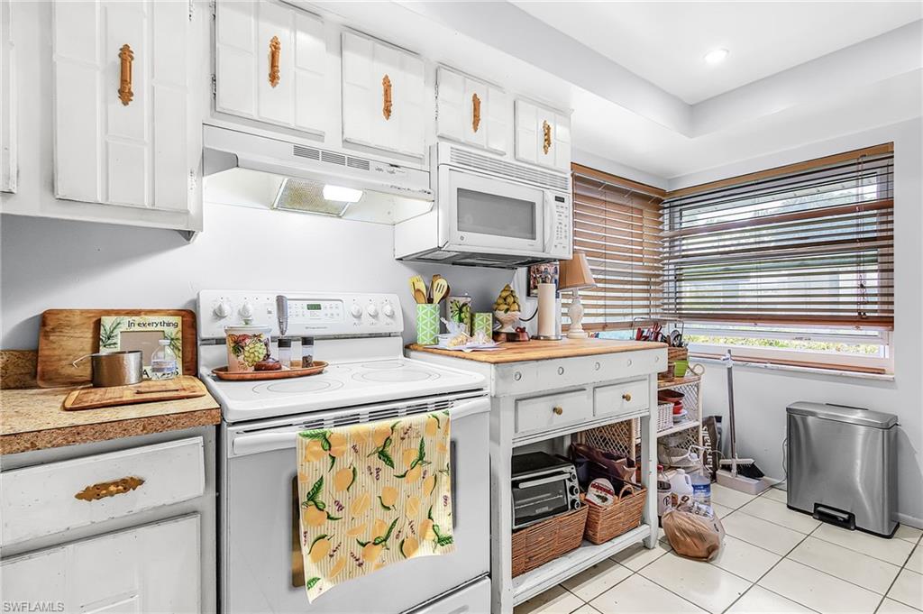 5579 Rattlesnake Hammock Road, Unit B9 Naples, FL 34113 - Photo 6 of 20 a utility room with sink dryer and washer