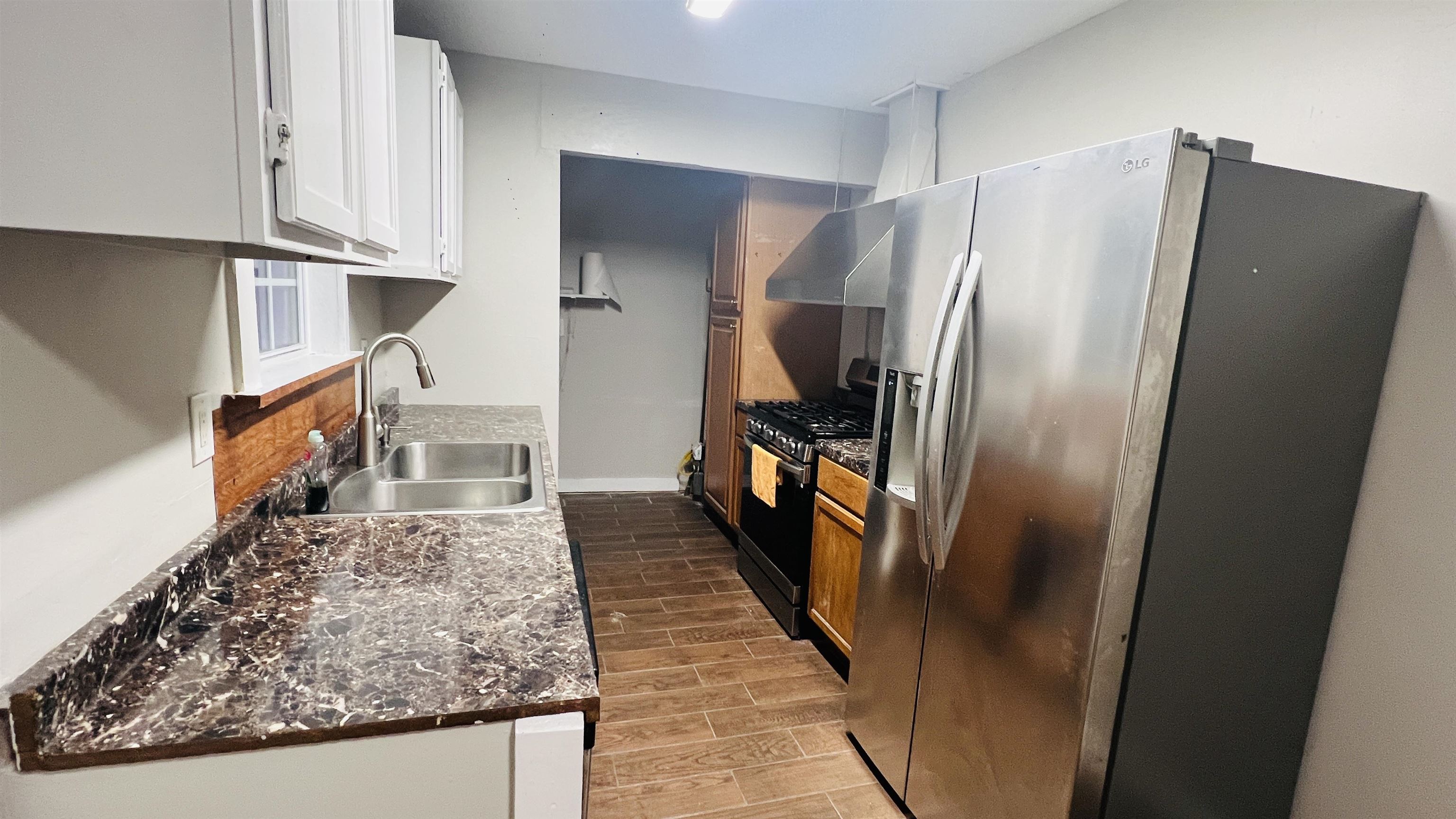 8645 Loomis Road Bartlett, TN 38002 - Photo 13 of 15 a view of a kitchen from the hallway
