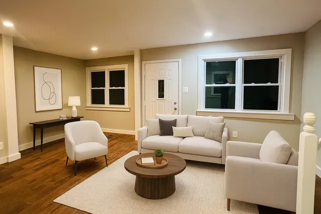 a living room with furniture and a large window