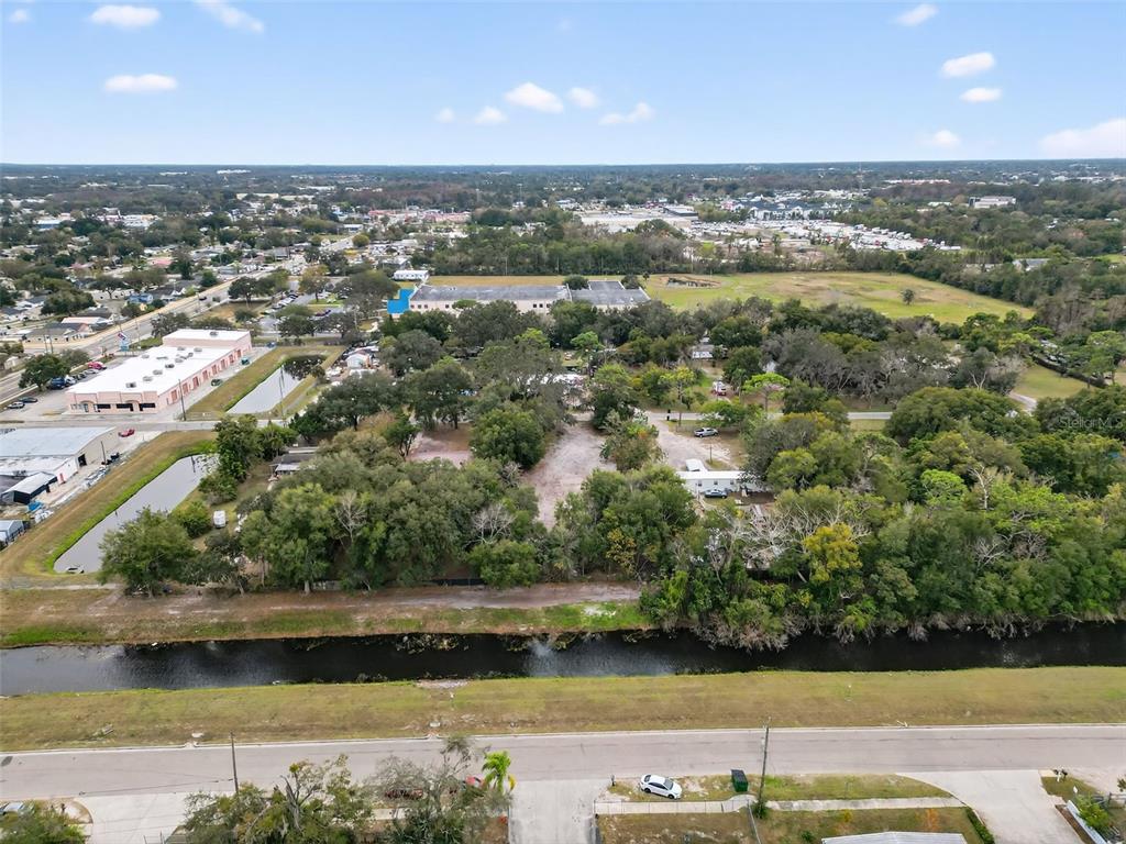6935 Turquoise Lane Orlando, FL 32807 - Photo 2 of 27 an aerial view of a residential houses with outdoor space and lake view