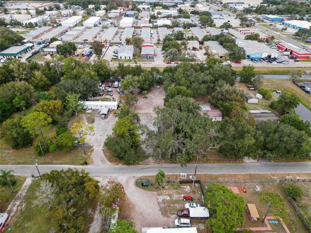 6935 Turquoise Lane Orlando, FL 32807 - Photo 24 of 27 an aerial view of residential houses with outdoor space and trees