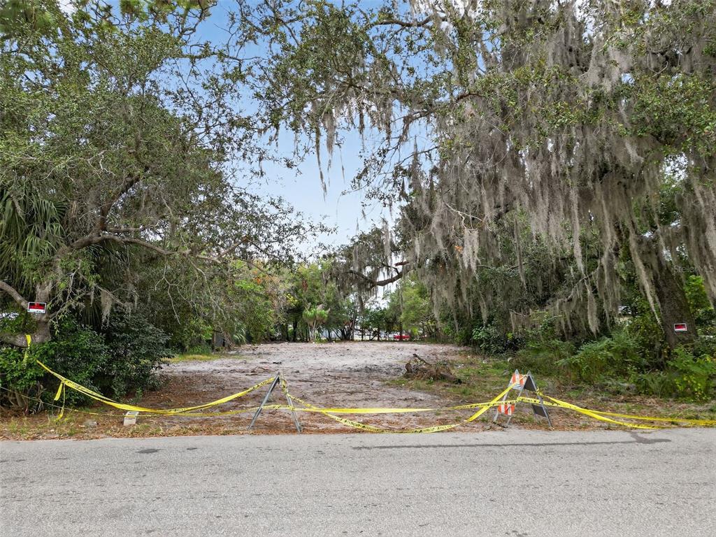 6935 Turquoise Lane Orlando, FL 32807 - Photo 7 of 27 a view of dirt field with trees in the background