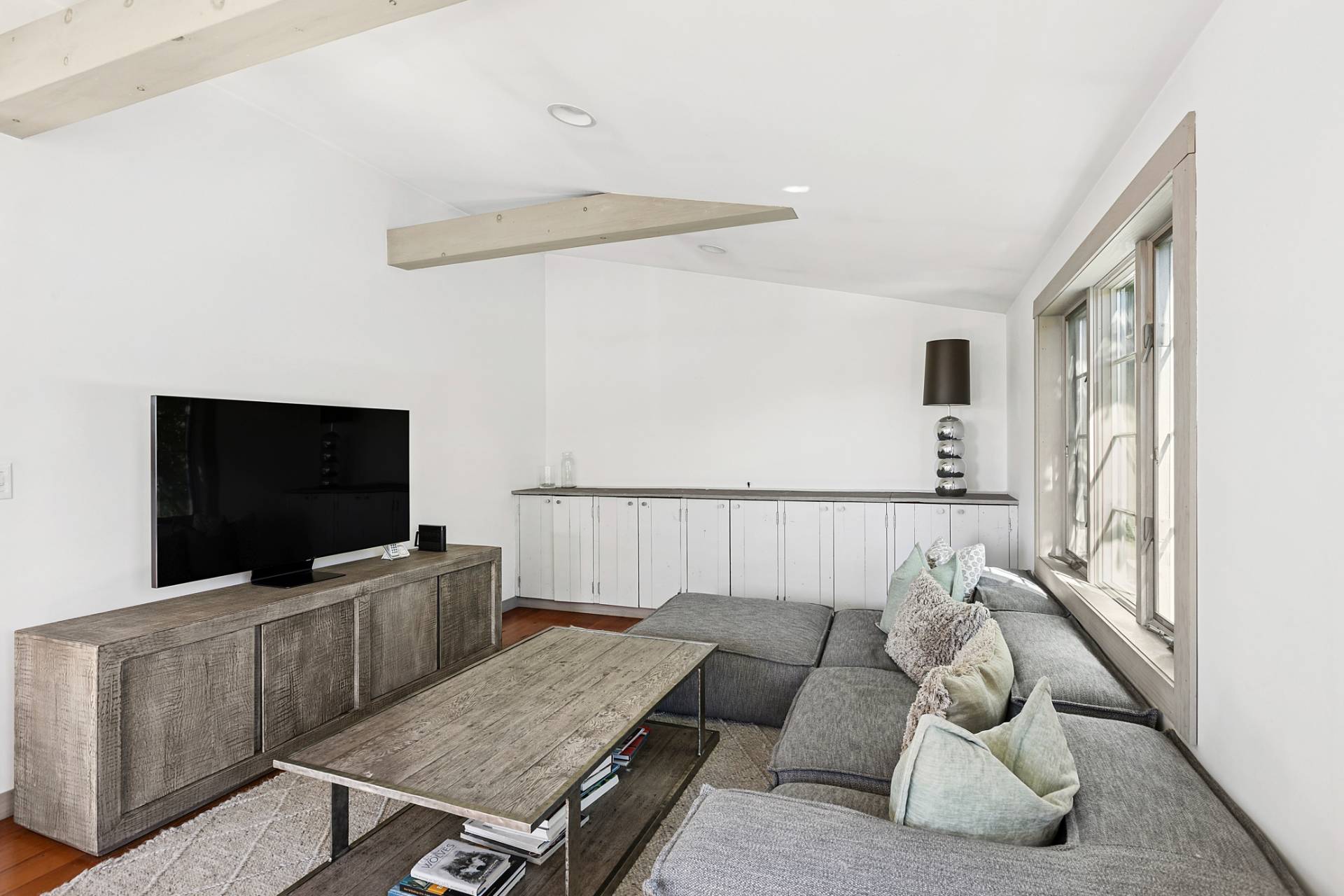 178 Sayre's Path Wainscott, NY 11975 - Photo 18 of 32 a living room with furniture and a flat screen tv