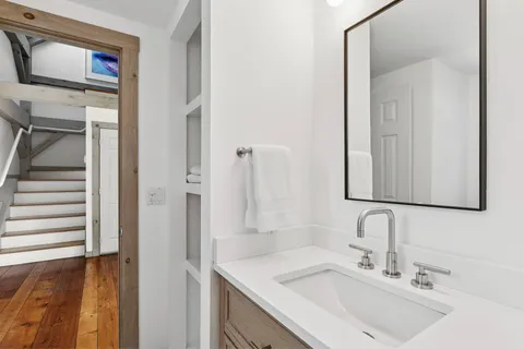 a bathroom with a sink and a mirror