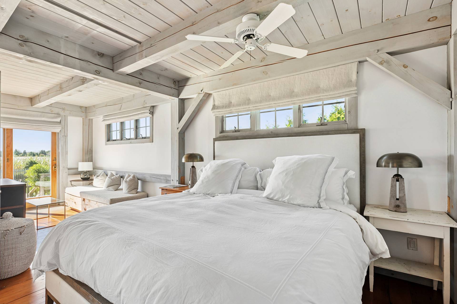 178 Sayre's Path Wainscott, NY 11975 - Photo 20 of 32 a bedroom with a large bed and a chandelier