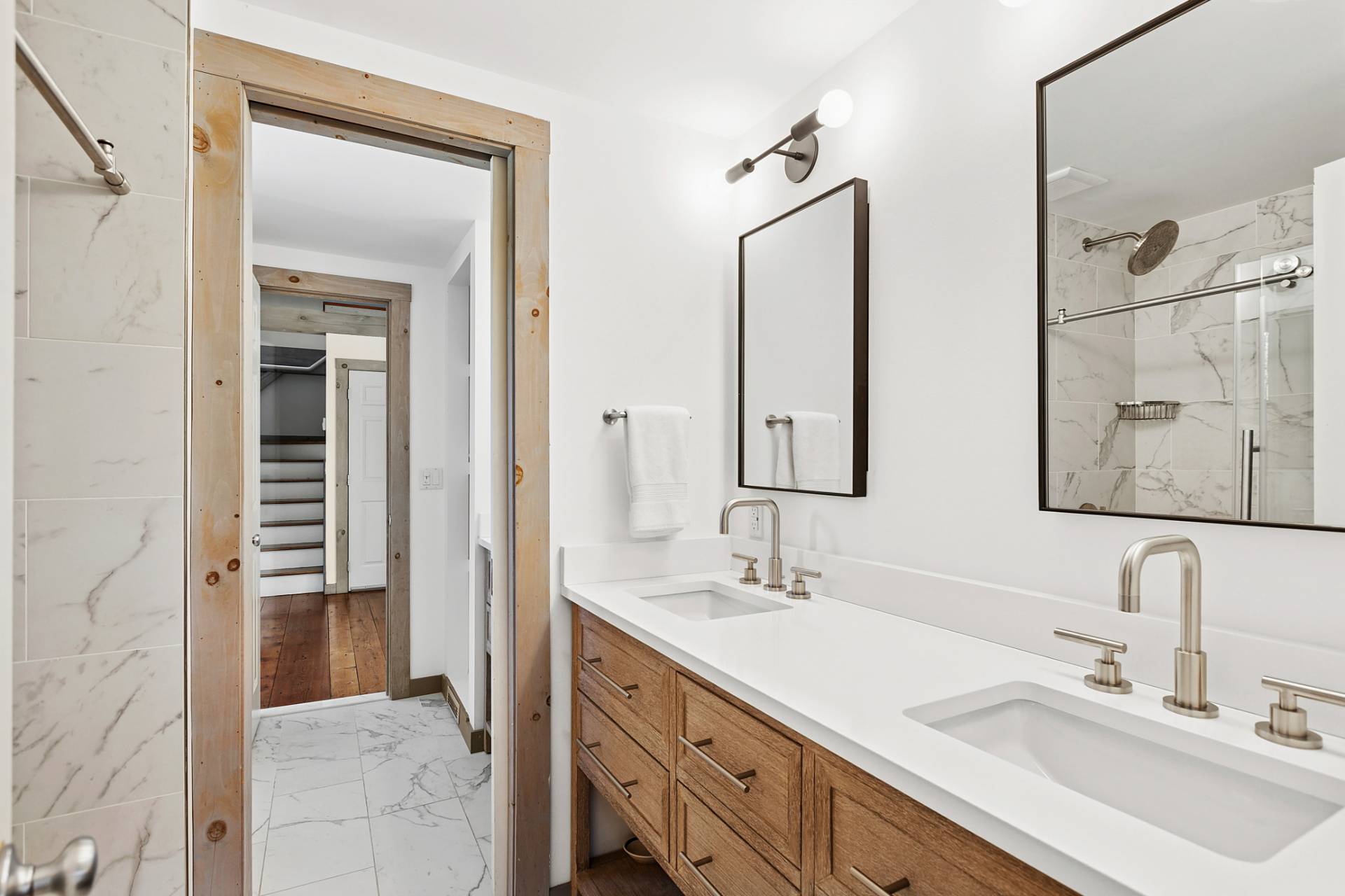 178 Sayre's Path Wainscott, NY 11975 - Photo 23 of 32 a bathroom with double vanity sink and a mirror