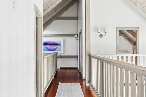 a view of a hallway view with staircase