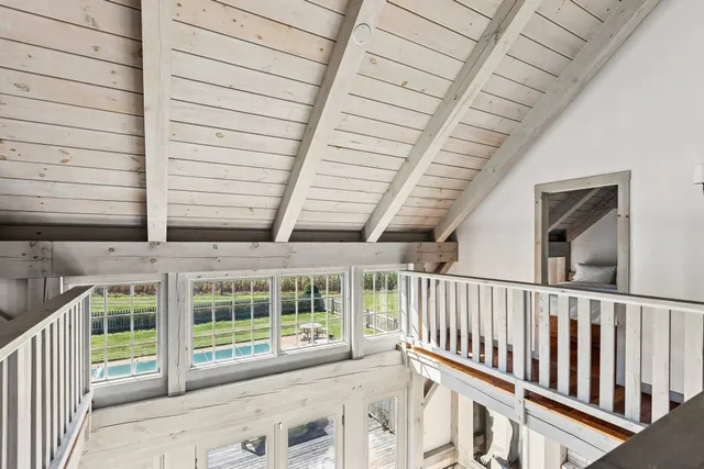 a view of a porch with wooden floor and roof