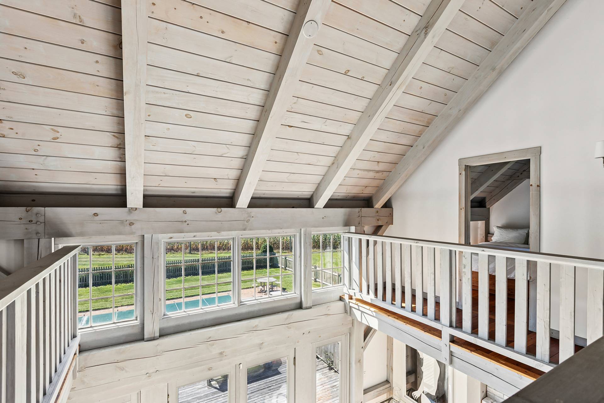 178 Sayre's Path Wainscott, NY 11975 - Photo 25 of 32 a view of a porch with wooden floor and roof