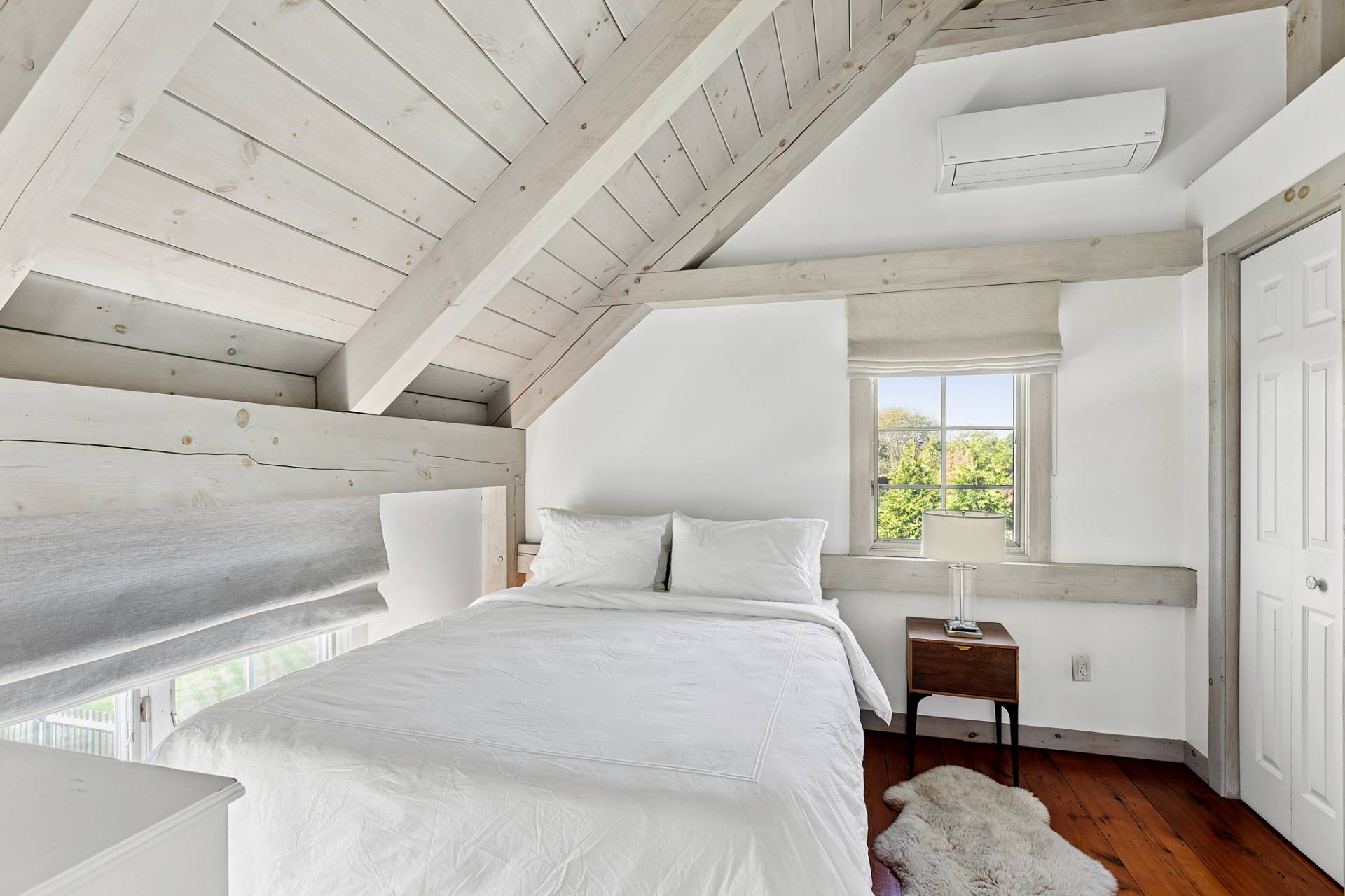 178 Sayre's Path Wainscott, NY 11975 - Photo 29 of 32 a bedroom with a bed chair and a window