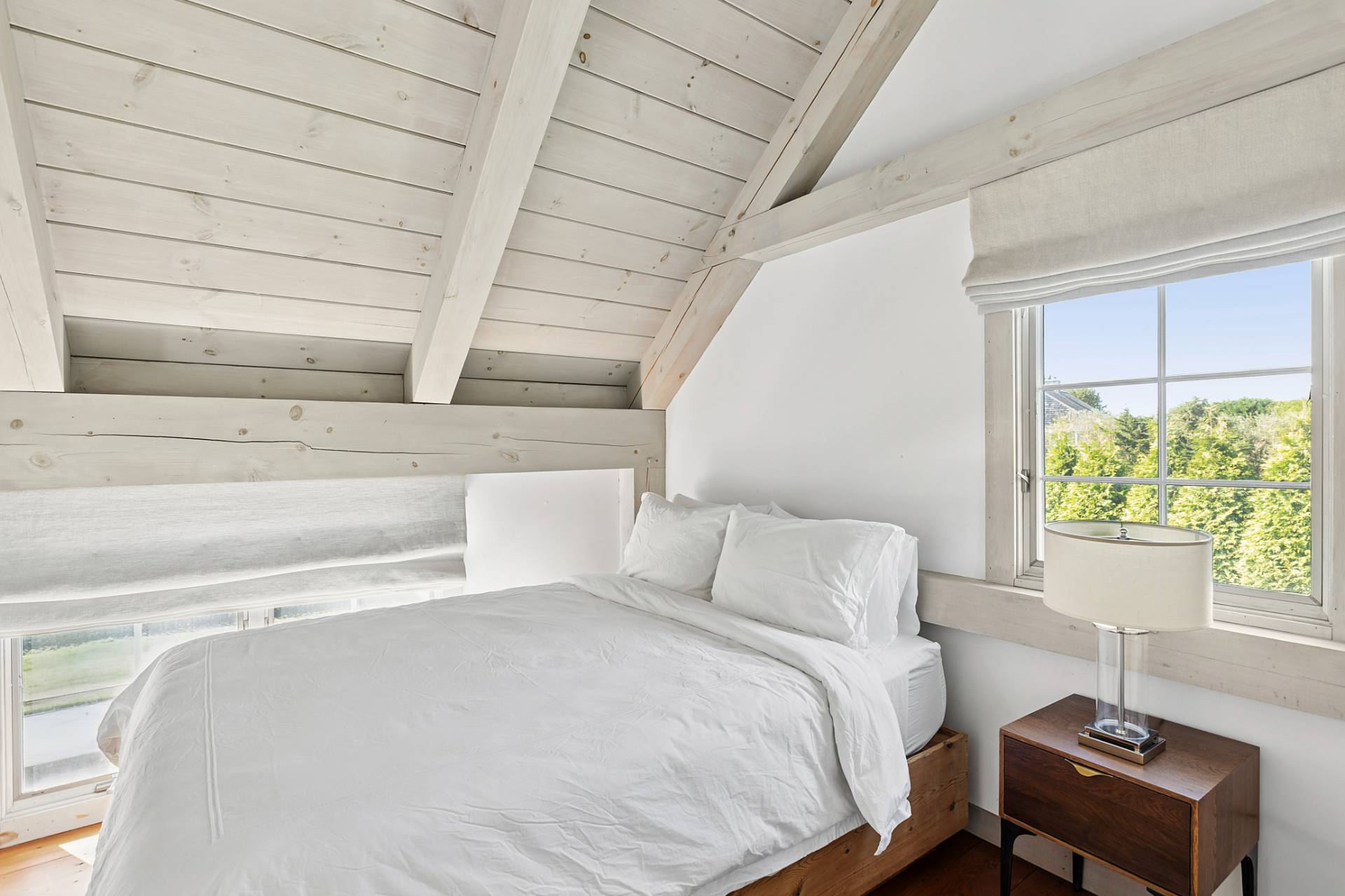 178 Sayre's Path Wainscott, NY 11975 - Photo 31 of 32 a bedroom with a bed and a window