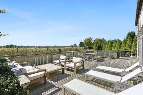 a view of a patio with couches chairs and a table