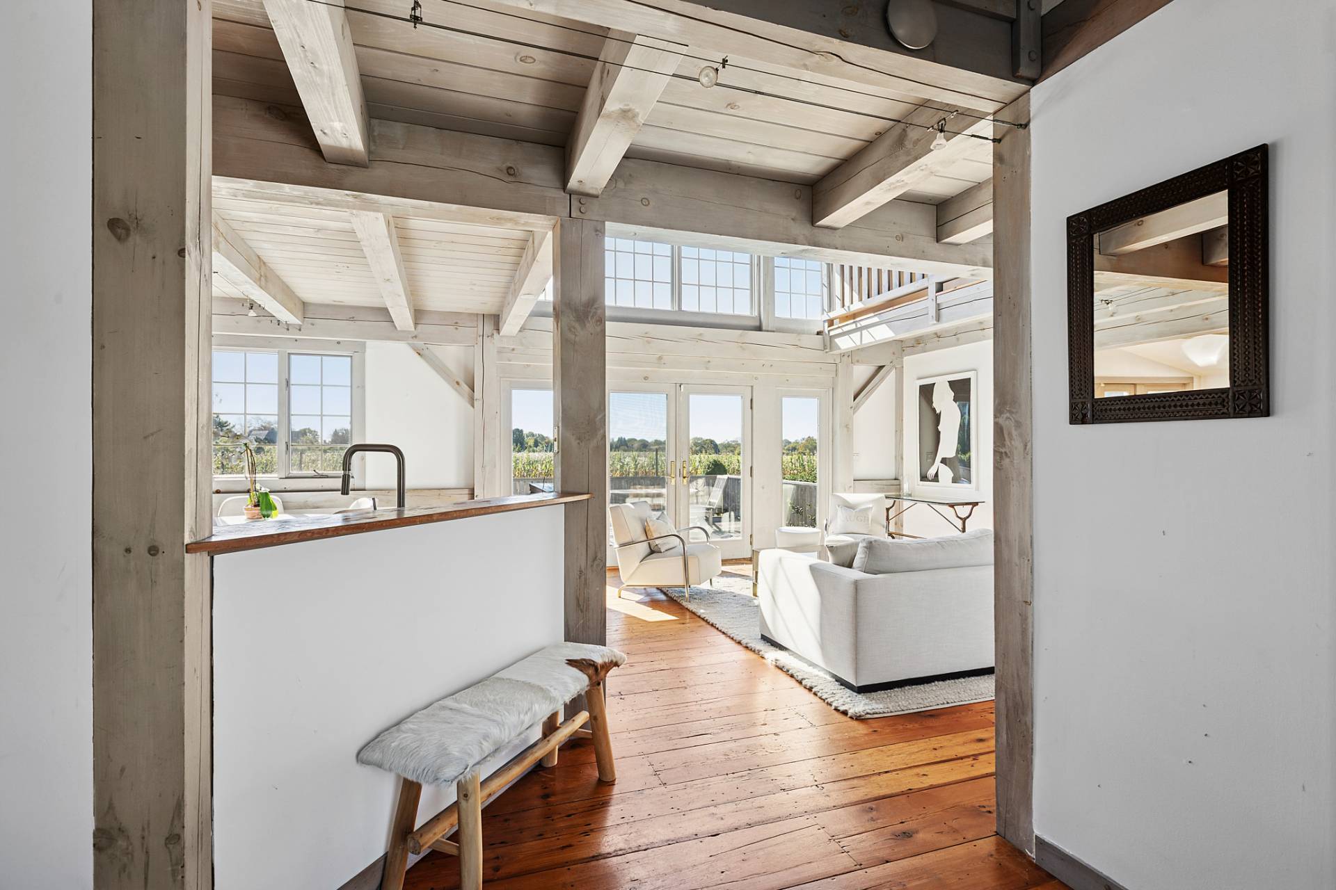 178 Sayre's Path Wainscott, NY 11975 - Photo 8 of 32 a living room with furniture and a large window