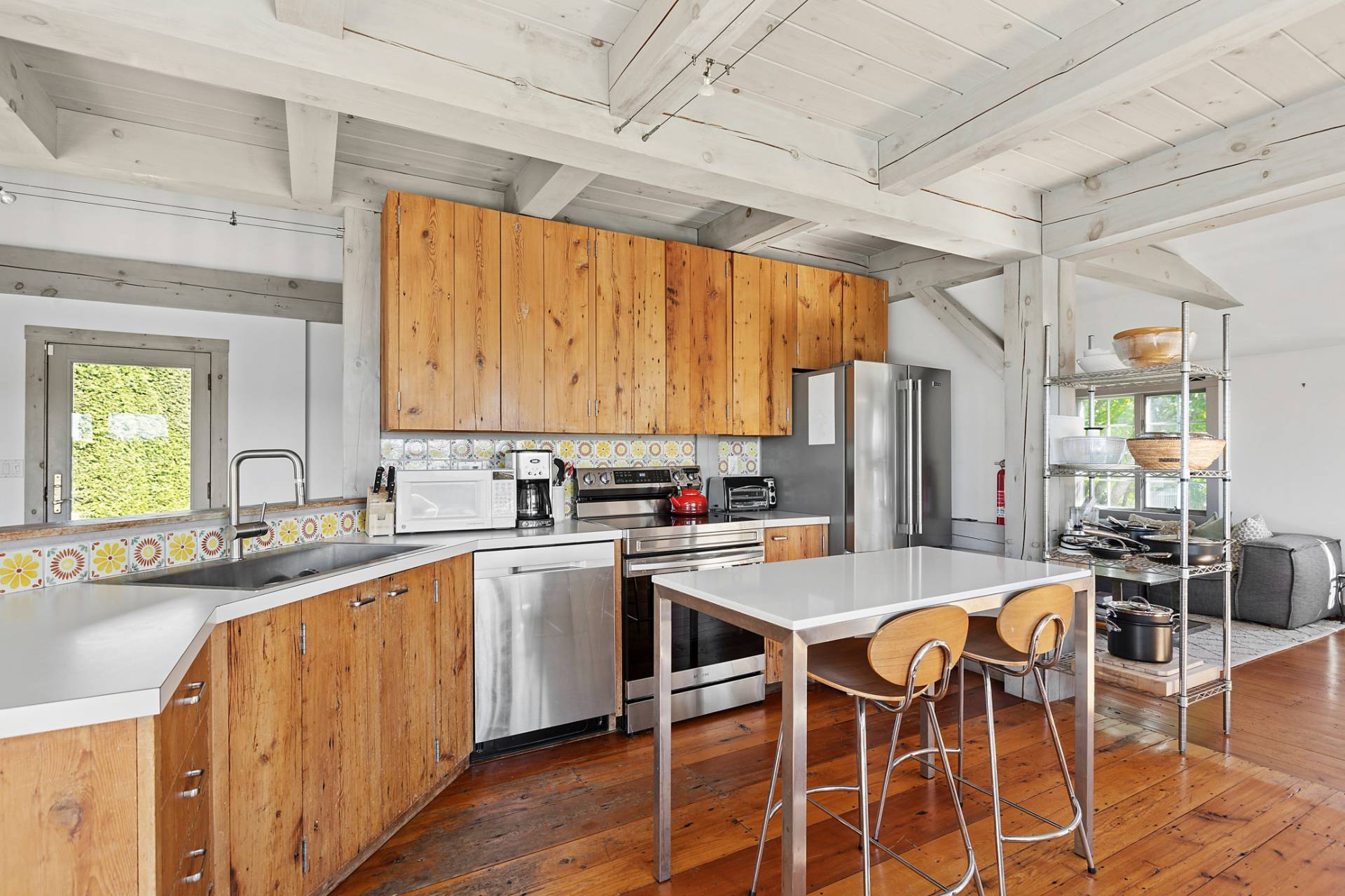 178 Sayre's Path Wainscott, NY 11975 - Photo 9 of 32 a kitchen with appliances a sink and cabinets