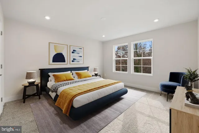 a bedroom with a large bed and a window