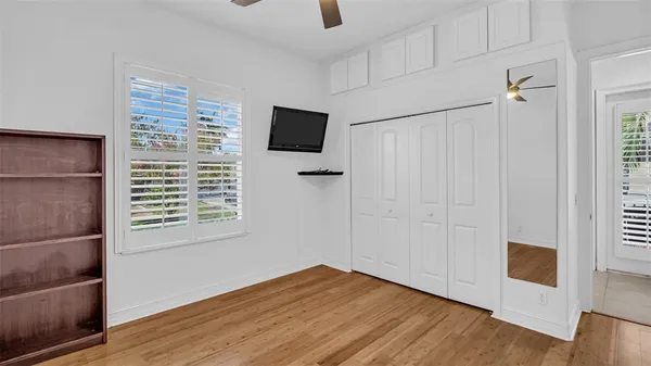 wooden floor in an empty room with a window