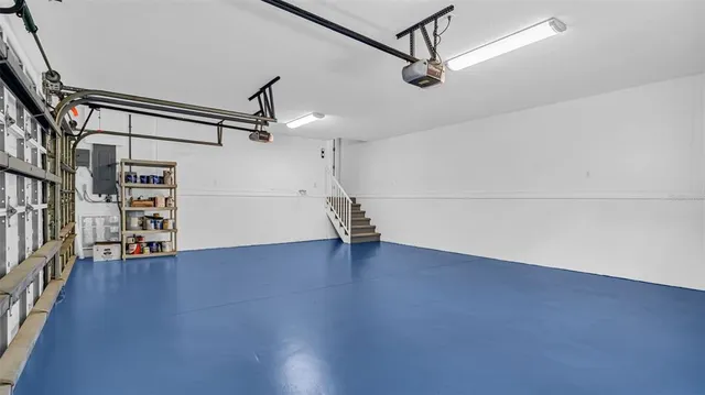 a front view of a house with a yard and fountain