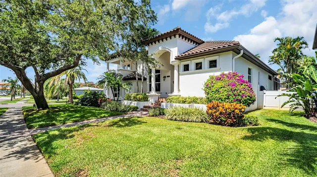 an aerial view of a house with garden space and sitting area