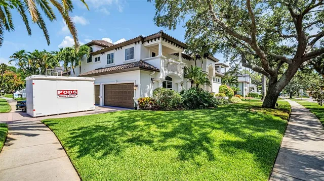 a front view of house with yard and outdoor seating