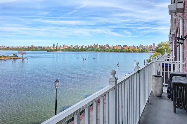 a view of a balcony next to a lake