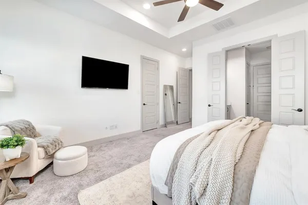 a bathroom with a tub a sink and mirror