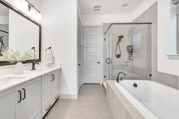 a bathroom with a tub and a shower