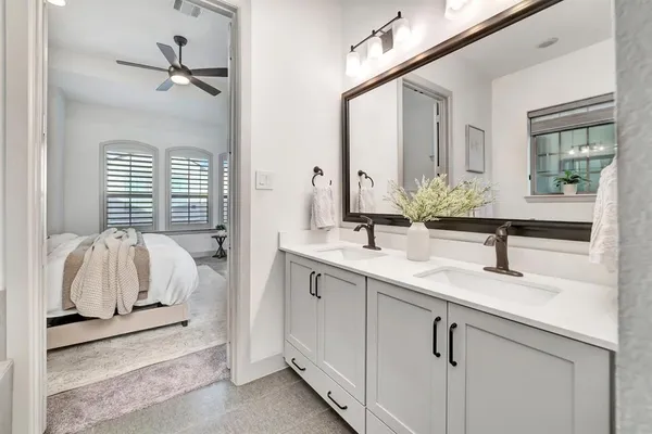 a view of a bedroom with a bed and a window