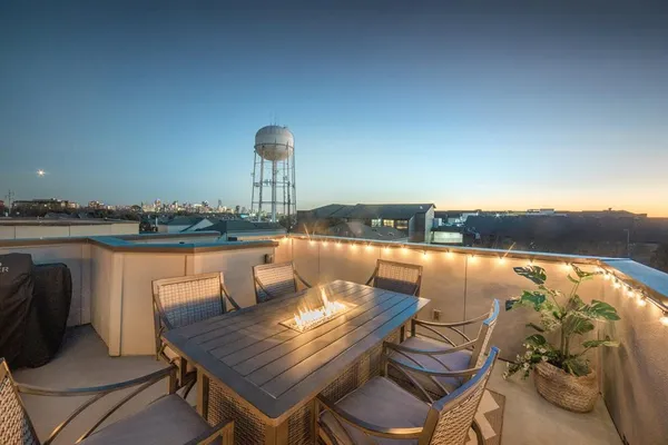 a view of a balcony with furniture