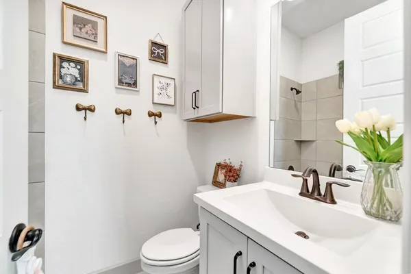 a bedroom with a bed next to a large window with outer view