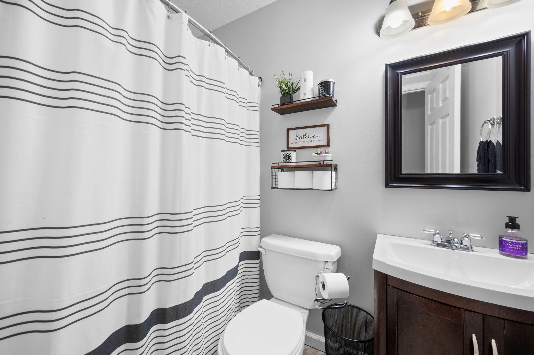 1197 Biter Road Cunningham, TN 37052 - Photo 24 of 38 a bathroom with a sink a toilet and a mirror