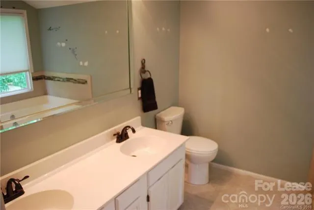 a bathroom with a shower and a tub