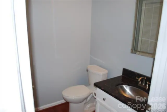 a bathroom with a toilet and sink