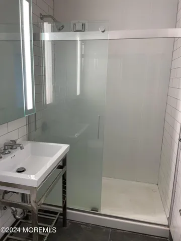 a bathroom with a sink and a shower