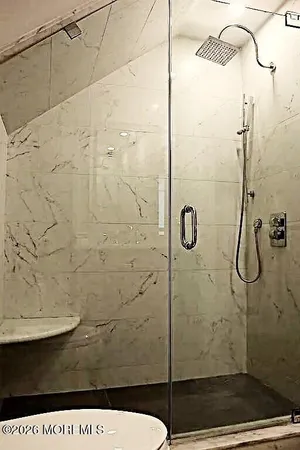 a living room with fireplace furniture and a flat screen tv