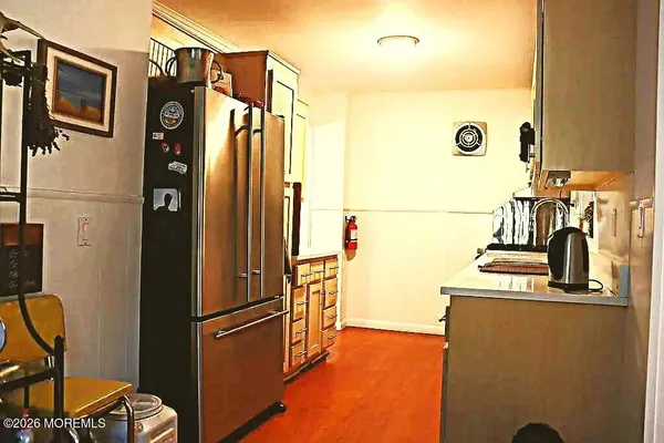 a kitchen with a sink a stove and cabinets